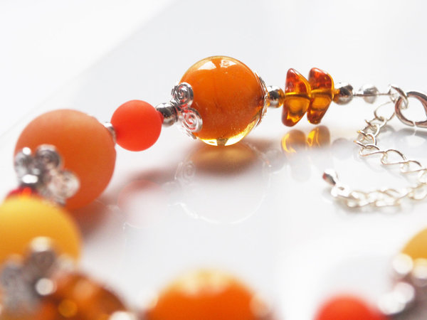 Polarisarmband orange | mit Glas- und Achatperlen